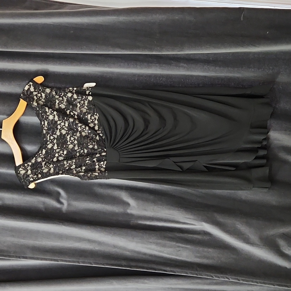 Flattering and elegant black cocktail dress. Size 16.